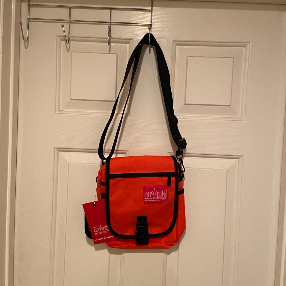 NWT Manhattan Portage Urban Orange Crossbody Bag 
Item 1407 TWCH-6436US